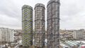 Три башни цилиндрической формы достигают высоты 36 этажей. Фото 13.03.2021 г.